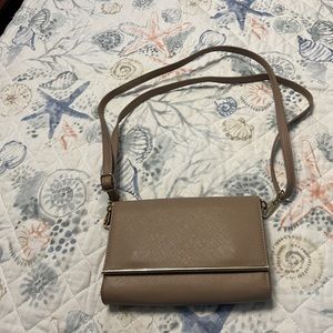 Crossbody purse with cellphone window.  Brand new without tags.
